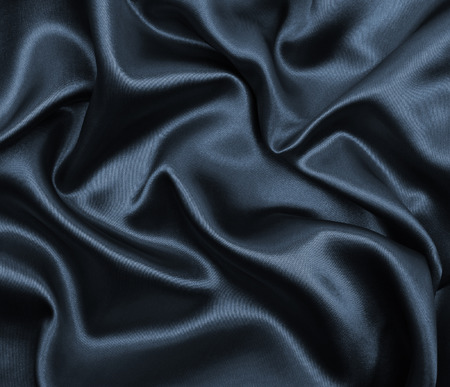 Smooth elegant dark grey silk or satin texture can use as abstract background. Luxurious background designの写真素材