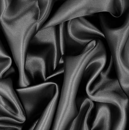 Smooth elegant dark gray silk or satin texture can use as abstract background. Luxurious background designの写真素材