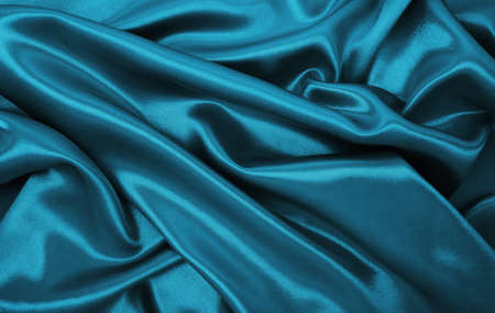 Smooth elegant blue silk or satin luxury cloth texture can use as abstract background. Luxurious Christmas background or New Year background designの写真素材