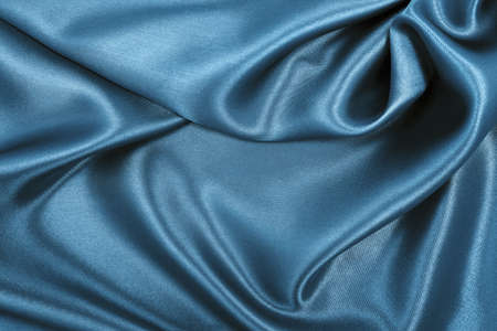 Smooth elegant blue silk or satin luxury cloth texture can use as abstract background. Luxurious Christmas background or New Year background designの写真素材