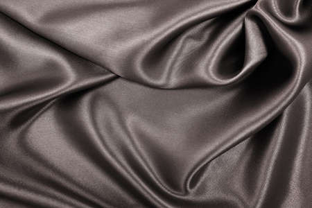 Smooth elegant brown silk or satin texture can use as abstract background. Luxurious background design. In Sepia toned. Retro styleの写真素材