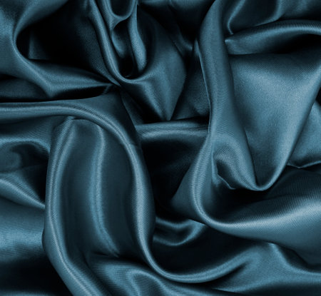 Smooth elegant dark gray silk or satin texture can use as abstract background. Luxurious background designの写真素材