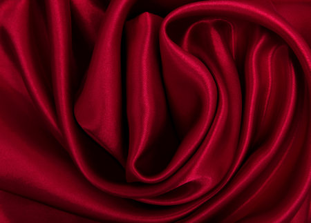Smooth elegant red silk or satin luxury cloth texture can use as abstract background. Luxurious valentines day background designの写真素材