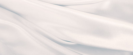 Smooth elegant grey silk or satin luxury cloth can use as wedding background. Luxurious background designの写真素材