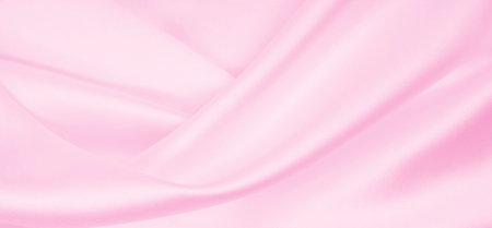 Smooth elegant pink silk or satin texture can use as wedding background. Luxurious valentine day background designの写真素材