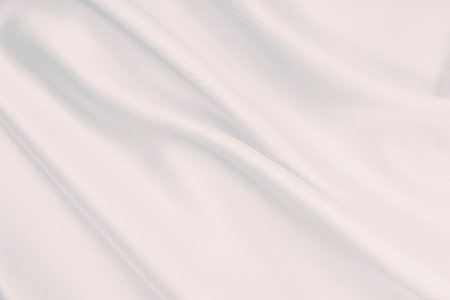 Smooth elegant grey silk or satin luxury cloth can use as wedding background. Luxurious background designの写真素材