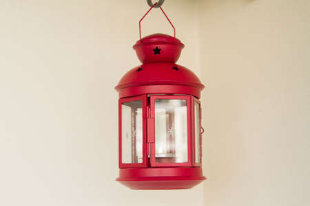 Decorative red metal lantern on light backgroundの写真素材