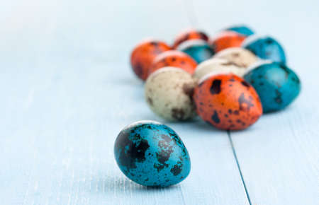Easter background. Colorful easter eggs on wooden background.の写真素材