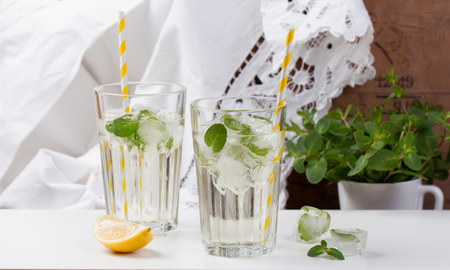Homemade lemonade with ice, mint and fresh citrusesの写真素材