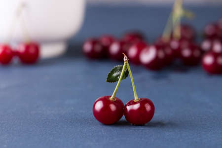 Cherries on grey stone backgroundの写真素材