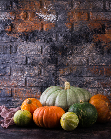 Autumn still life with pumpkins. Autumn Pumpkin Thanksgiving Background - pumpkins over wooden tableの写真素材