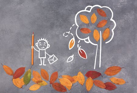 Childs with pensils and school bags sketch. Drawing of back to school concept on blackboard. Sketch with autumn leaves.の写真素材