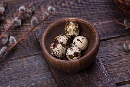 Easter eggs on wooden background with blank cardの写真素材
