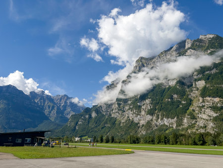 View of the mountains and clouds on a sunny summer dayの写真素材