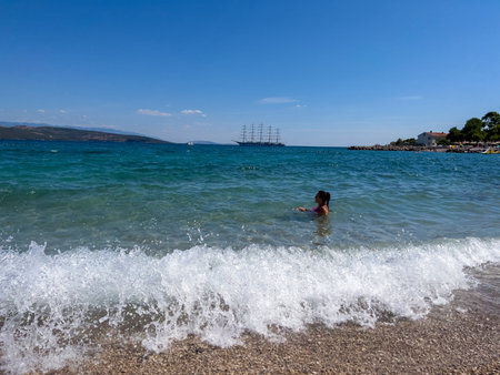 The girl bathes in the seaの写真素材