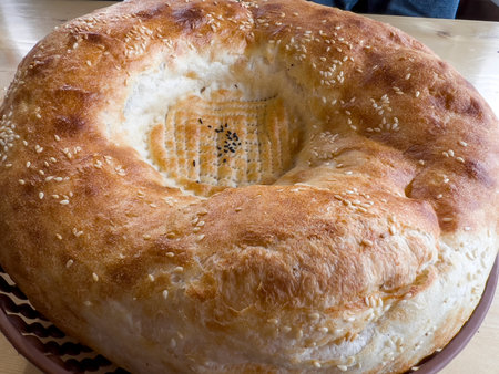 Close up of a freshly baked bagel with sesame seeds.の写真素材