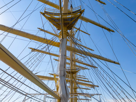 Masts of a tall ship against the blue sky, close-upの写真素材