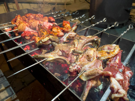 Grilled meat on barbecue grill. Roasted meat on coalsの写真素材