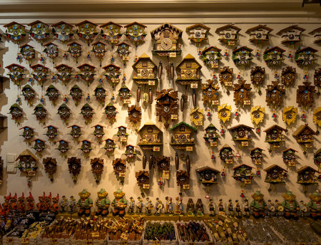 Wooden cuckoo clocks with price tags in a shop.の写真素材