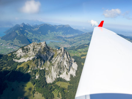 The flight over the green Alps.の写真素材