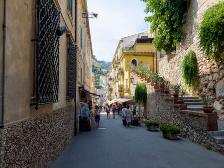 Tourist shopping street in Taormina.の写真素材