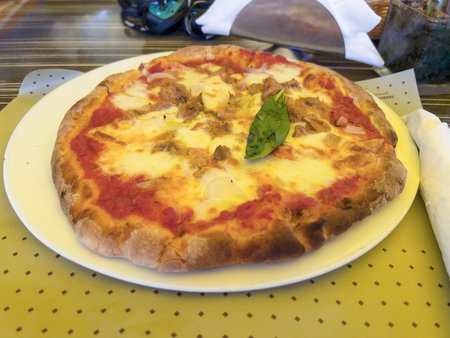 The delicious pizza in a restaurant in Italy.の写真素材