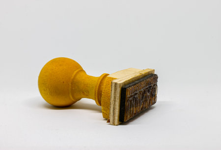 Wooden stamp on a white backgroundの写真素材