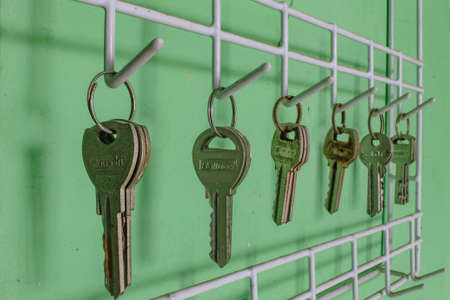 Locks lined up hanging on the wallの写真素材
