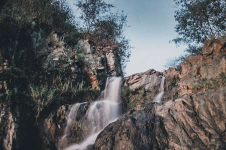 Waterfalls that flow on large rocksの写真素材