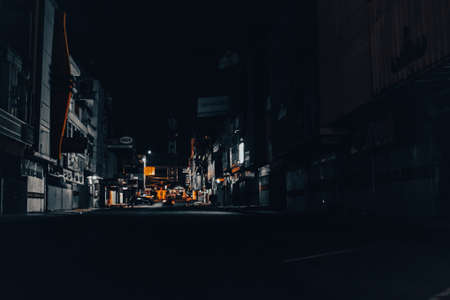 Lampung, Indonesia - August 4, 2021 : The atmosphere on an urban street at night in Lampung, Indonesia.のeditorial素材