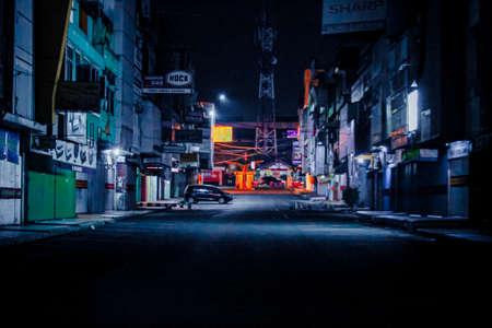 Lampung, Indonesia - August 4, 2021 : The atmosphere on an urban street at night in Lampung, Indonesia.のeditorial素材