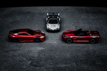 Close-up view of a children's toy car on a black background photographed indoors.の写真素材