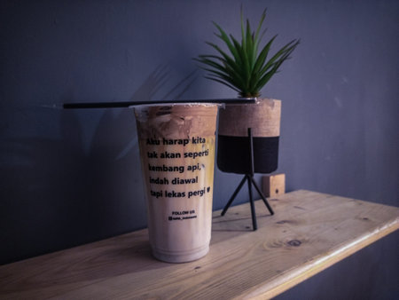 Cold cappuccino coffee drinks on a wooden table