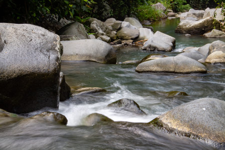 The flow of river water flowing through the rocks