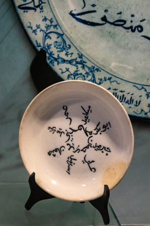 Plates made of ceramic that are used as glass cabinet decorations