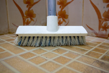 Floor brush made of plastic material with floor and wall backgroundの写真素材