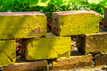 The background of the arrangement of bricks used as a fence for plants