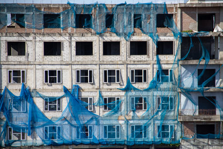 Unfinished building wall background in urban areaの写真素材