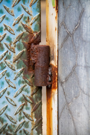 Steel door hinges that have rusted due to rain