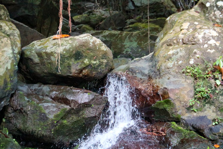 The water flow in the river that passes through the rocksの写真素材