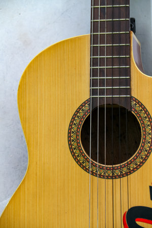 Acoustic guitar on a white background, closeup of photo.の写真素材