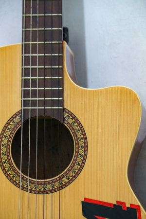 Acoustic guitar on a white background. Close-up image.の写真素材