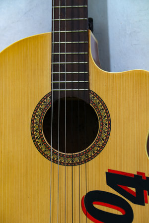 Acoustic guitar on a white background, closeup of photo.の写真素材