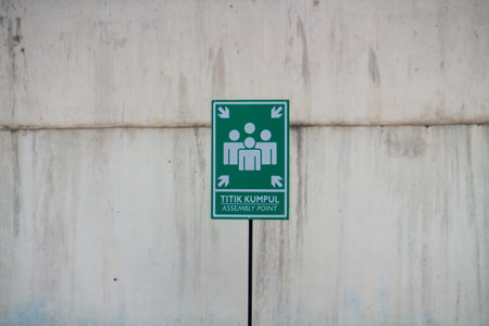 Green sign on the wall of the building for social distancing.の写真素材