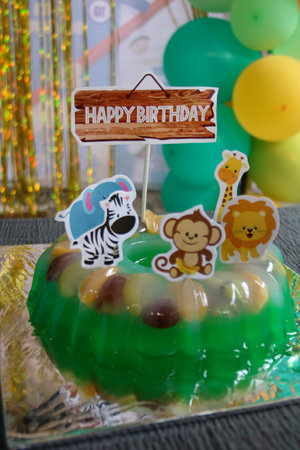 Birthday cake with zebra and zebra in green jelly.の写真素材