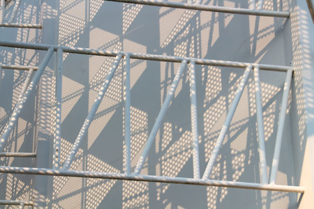 Close-up of a metal railing on a modern building in the city