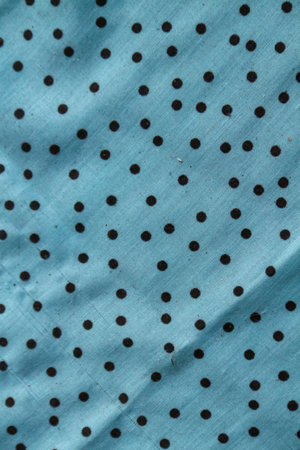 abstract background of blue fabric with small polka dots on itの写真素材