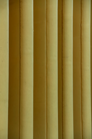 Yellow corrugated metal sheet useful as a background, vertical imageの写真素材