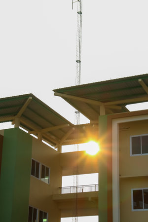 building under construction with sunbeams in the background, closeup of photoの写真素材