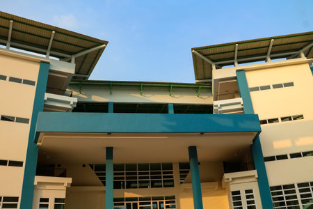 Residential building with blue sky background, closeup of photo.